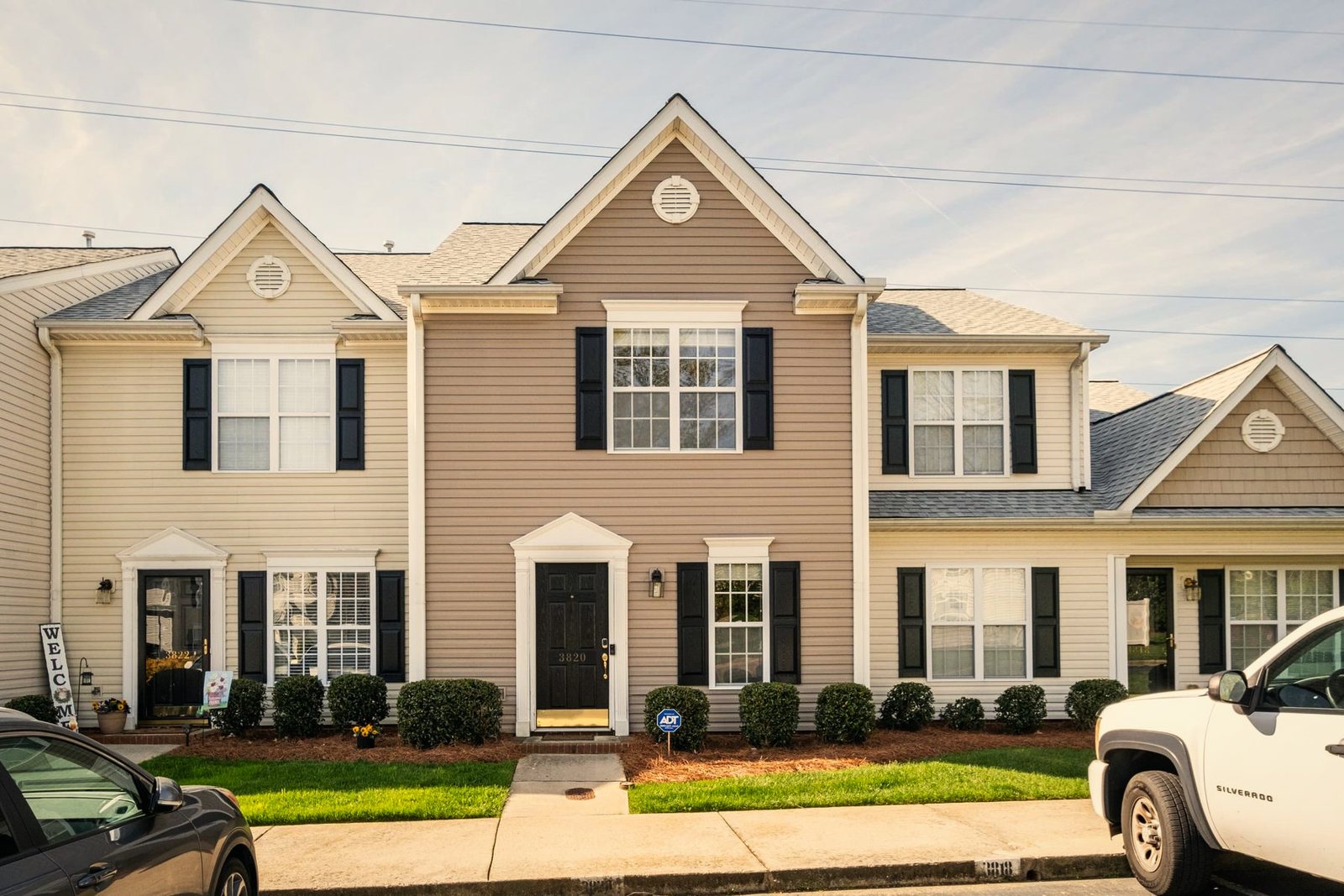 Front of Hickswood Townhome, a two-story townhouse with black shutters that BookedMore co-hosts in High Point, North Carolina