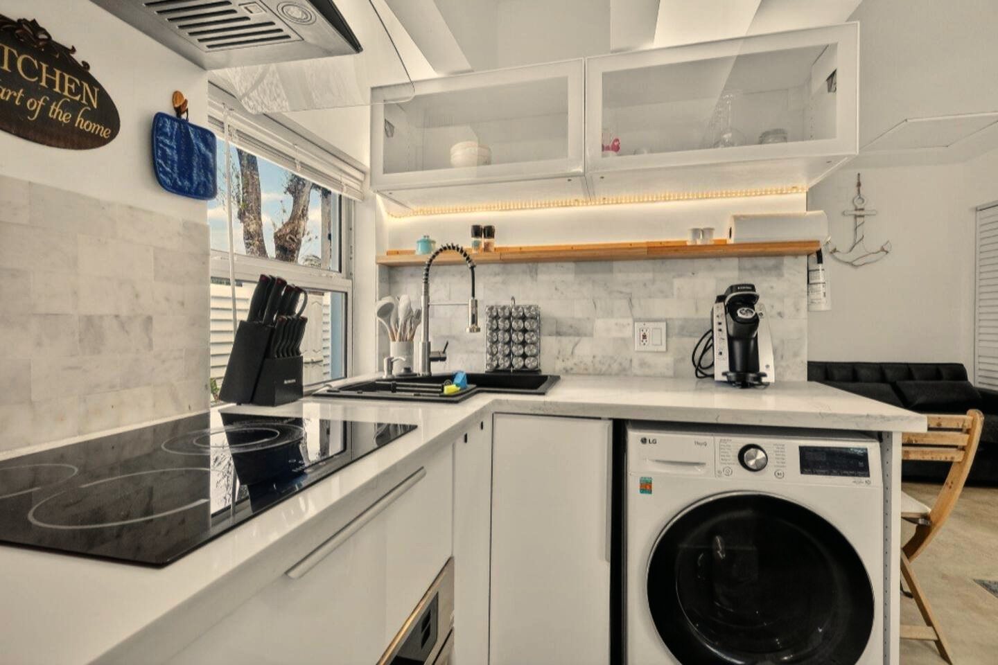 Kitchen and laundry at Hollywood Hideout, a studio BookedMore co-hosts in Fort Lauderdale, Florida