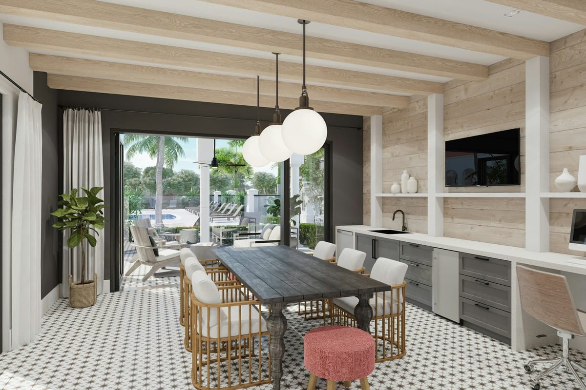 Bright open-plan living and dining room opening onto palm trees (stock photo, Unsplash License)